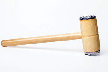Close up view of a meat hammer isolated on a white background.