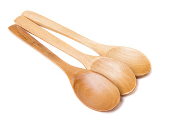 three wooden spoons isolated on white background.