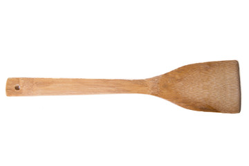 Close up view of one wooden spoon isolated on white background.