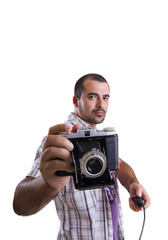  young man with a retro vintage photographic camera