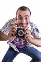 young happy man jumping with a camera 