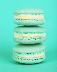 Gentle colorful macaroons on color background