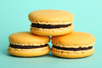 Gentle colorful macaroons on color background