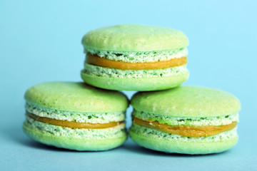 Gentle colorful macaroons on color background