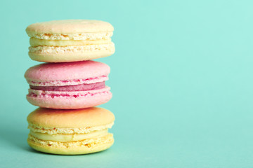Gentle colorful macaroons on color background