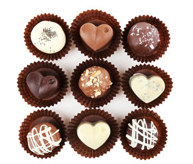 Delicious chocolate candies isolated on white