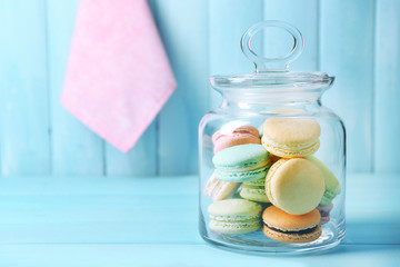 Gentle colorful macaroons in glass jar