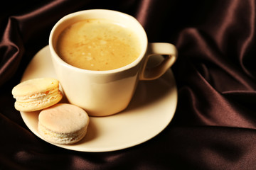 Gentle colorful macaroons and black coffee in mug