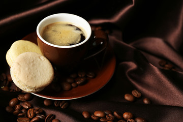 Gentle colorful macaroons and black coffee in mug