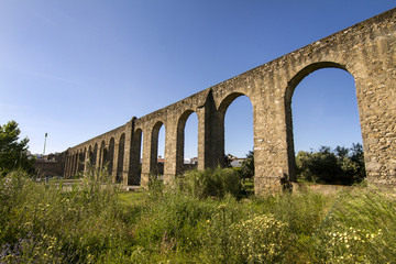 Fototapeta na wymiar View of the historical aqueduct located in Evora city, Portugal.