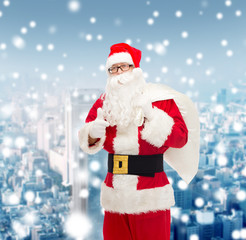 man in costume of santa claus with bag
