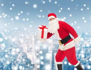man in costume of santa claus with gift box
