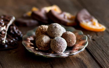 Chocolate, truffles and orange slices in dark chocolat