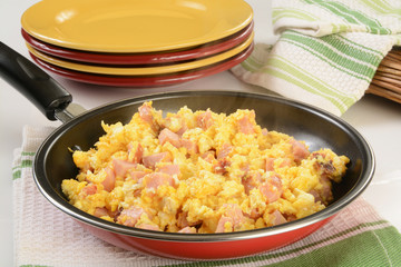 Scramble eggs with ham and cheese