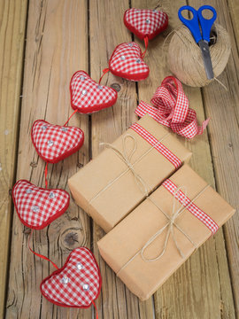 string and brown paper parcels with scissors, string, ribbon  an