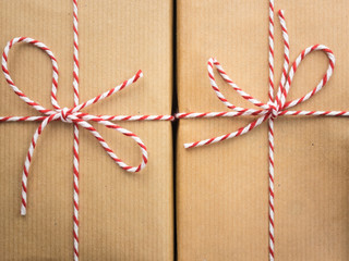 string bows against brown paper