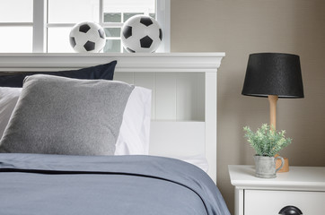 white bed with football on top