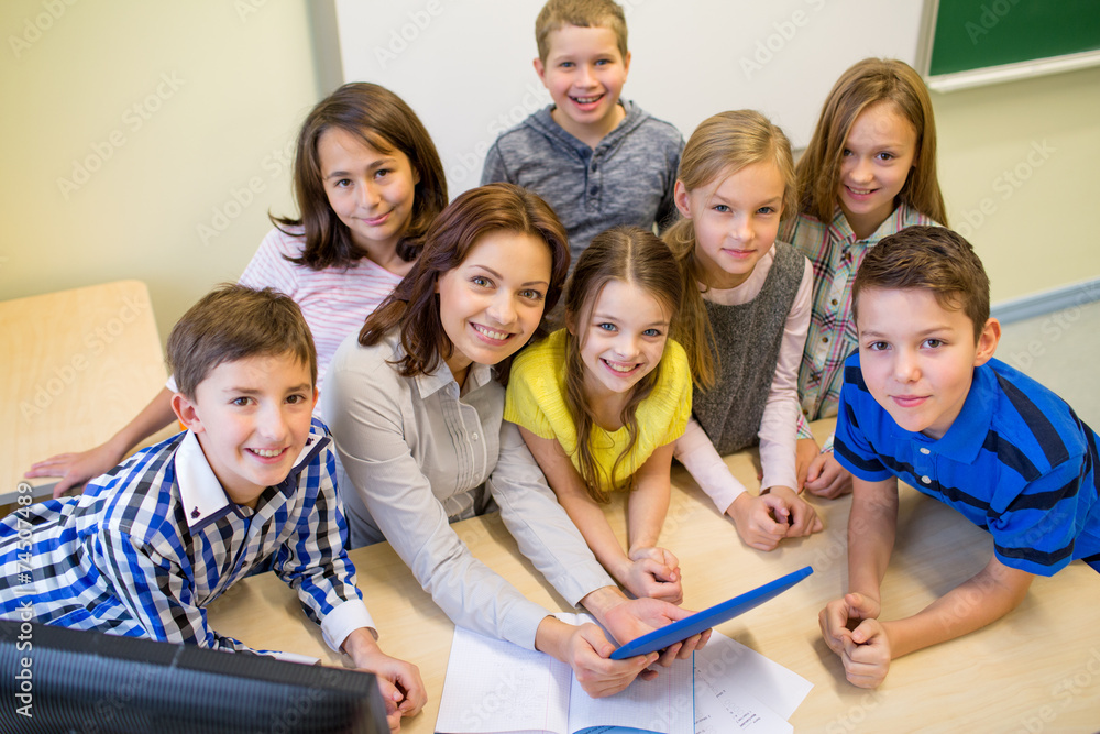 Poster group of kids with teacher and tablet pc at school