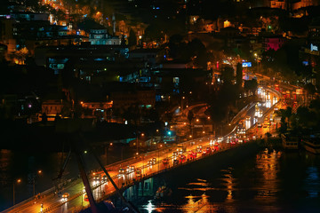 Fototapeta na wymiar Traffic over bridge during night time