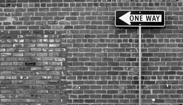 One Way street sign in black and white