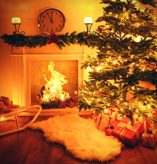 Christmas tree near fireplace in room