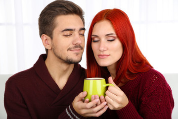 Loving couple with hot drink