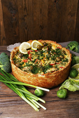 Vegetable pie with broccoli, peas, tomatoes and cheese