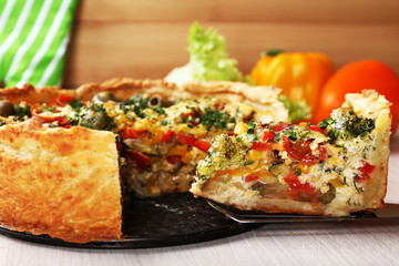 Vegetable pie with broccoli, peas, tomatoes and cheese