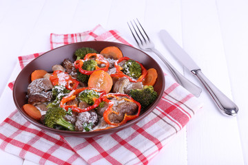 Braised wild mushrooms with vegetables and sauce in plate
