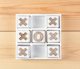 Game of Tic Tac Toe on wooden background