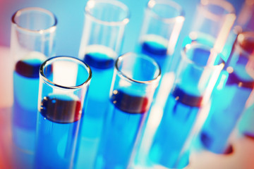 Test-tubes filled with color fluid close-up