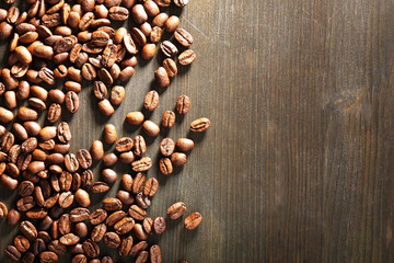 Coffee beans on wooden background