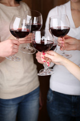 Woman hands with glasses of wine close-up