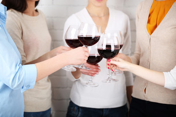 Woman hands with glasses of wine close-up