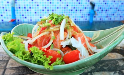 Fresh salmon salad with spices