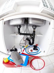 Plumber tools on the kitchen.