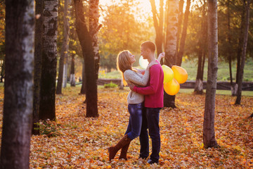 young couple in autumn park