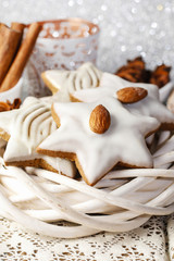 Fototapeta na wymiar Gingerbread cookies in star shape decorated with almonds