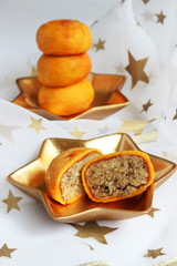 Christmas sweets (peach stuffed with nuts)