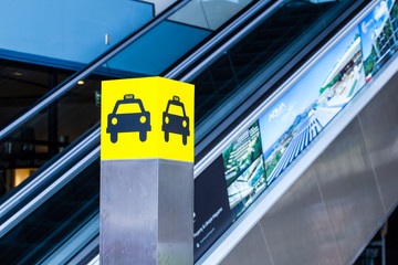 taxi stand, yellow taxi symbol pole signboard with light