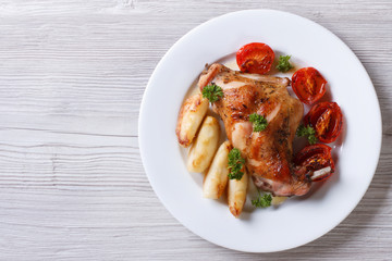 delicious grilled rabbit leg with apples horizontal top view