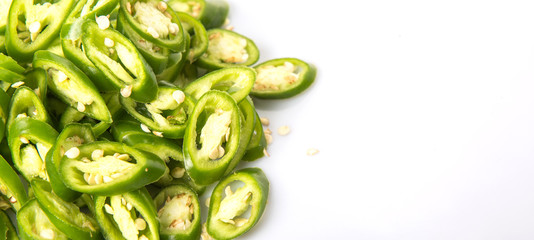 Green chili peppers over white background 