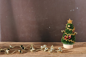 christmas tree ornament and decorations on wooden plank