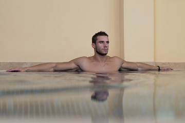 Male Swimmer Resting In Pool
