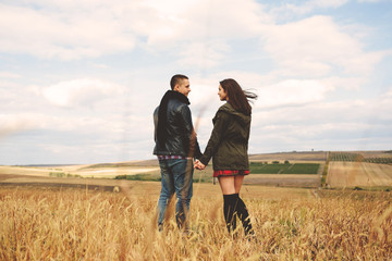 Landscape portrait of young beautiful stylish couple sensual and