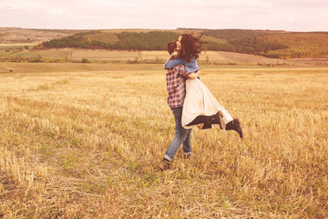 Naklejka premium Landscape portrait of young beautiful stylish couple sensual and