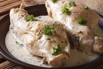 Dietary rabbit meat in cream sauce on the table. Horizontal