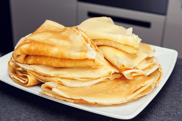 Sweet pancake on white plate