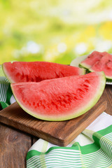 Juicy watermelon on table on bright background
