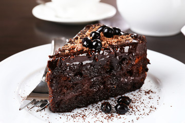 Yummy chocolate cake served on table, close-up